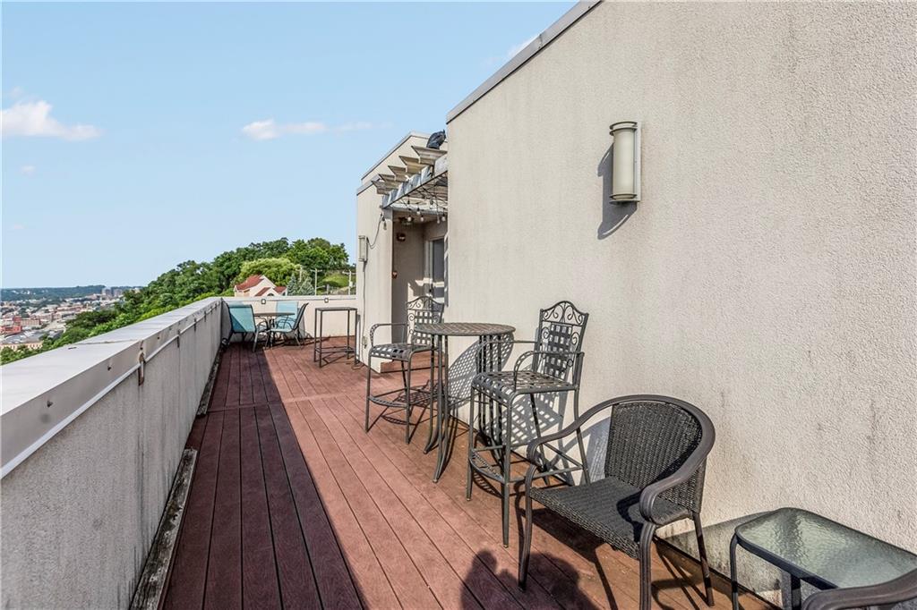1825 Arcena Street, Unit 3 Pittsburgh, PA 15219 - Photo 27 of 31 a view of a chairs and table on the balcony