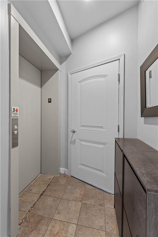 1825 Arcena Street, Unit 3 Pittsburgh, PA 15219 - Photo 3 of 31 a bathroom with a granite countertop sink and mirror