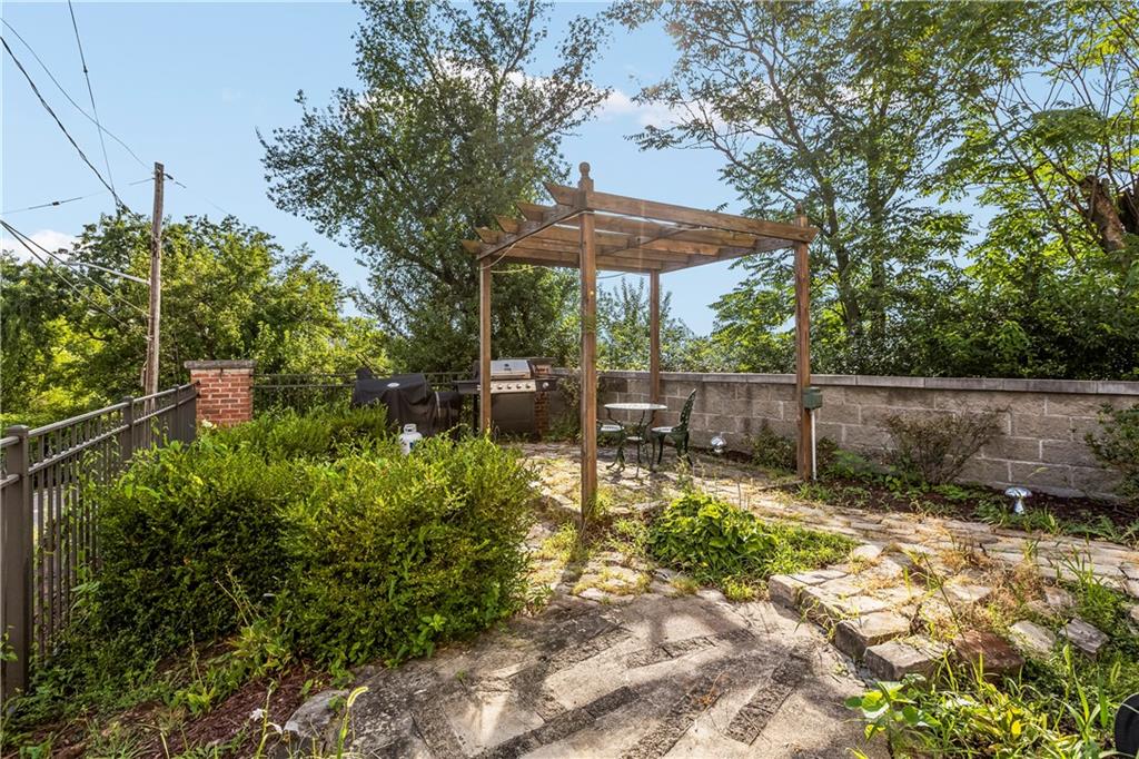 1825 Arcena Street, Unit 3 Pittsburgh, PA 15219 - Photo 31 of 31 a view of a backyard with plants and a patio