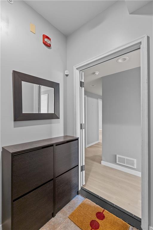 1825 Arcena Street, Unit 3 Pittsburgh, PA 15219 - Photo 4 of 31 a room with a wooden floor and a window