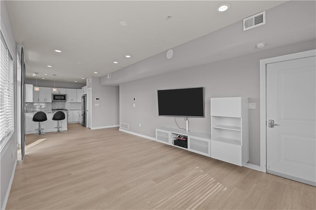 1825 Arcena Street, Unit 3 Pittsburgh, PA 15219 - Photo 8 of 31 a view of a livingroom with a flat screen tv