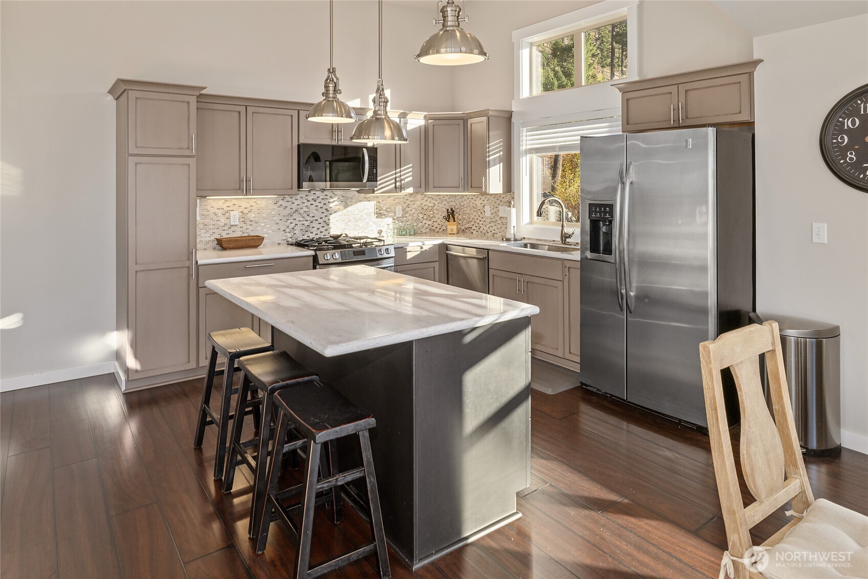 1840 Morgan Creek Road Ronald, WA 98940 - Photo 23 of 33 a kitchen with stainless steel appliances a refrigerator a stove a sink and white cabinets