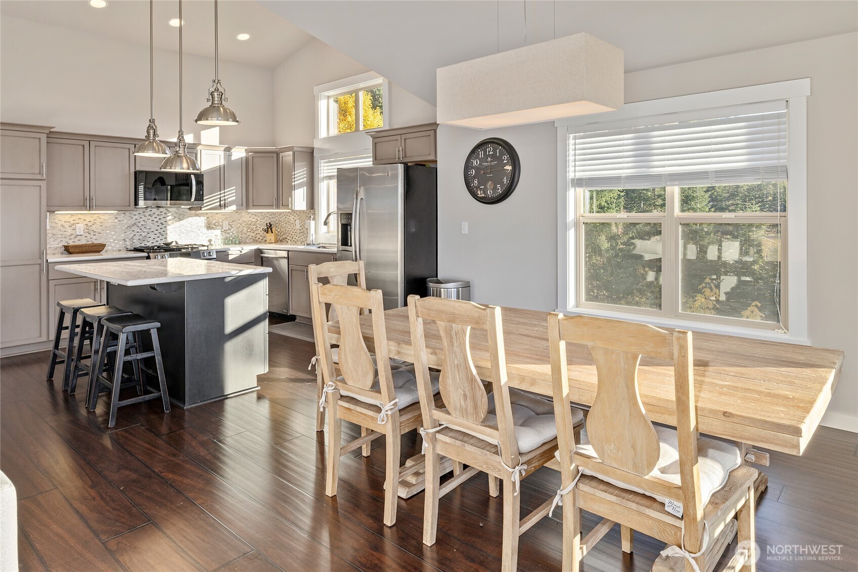 1840 Morgan Creek Road Ronald, WA 98940 - Photo 31 of 33 a kitchen with a dining table chairs and white cabinets
