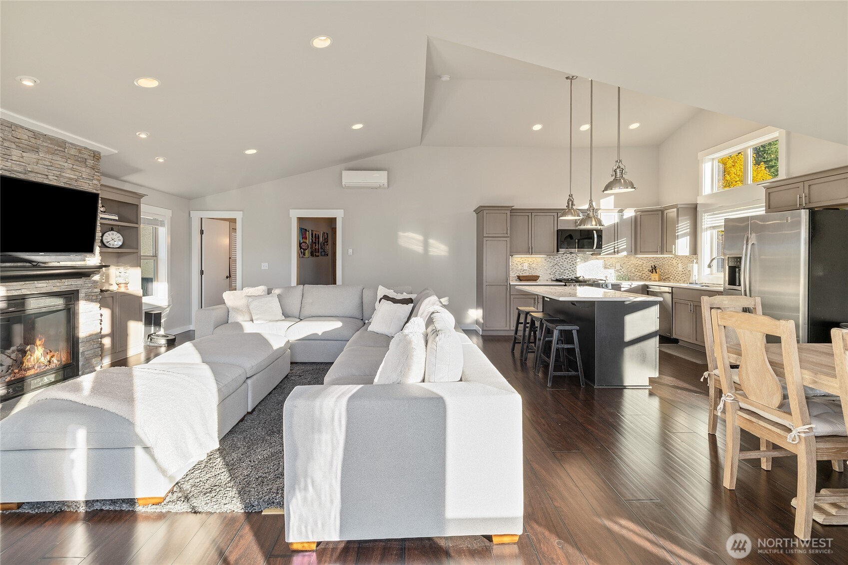 1840 Morgan Creek Road Ronald, WA 98940 - Photo 32 of 33 a living room with stainless steel appliances furniture a fireplace a flat screen tv and kitchen view