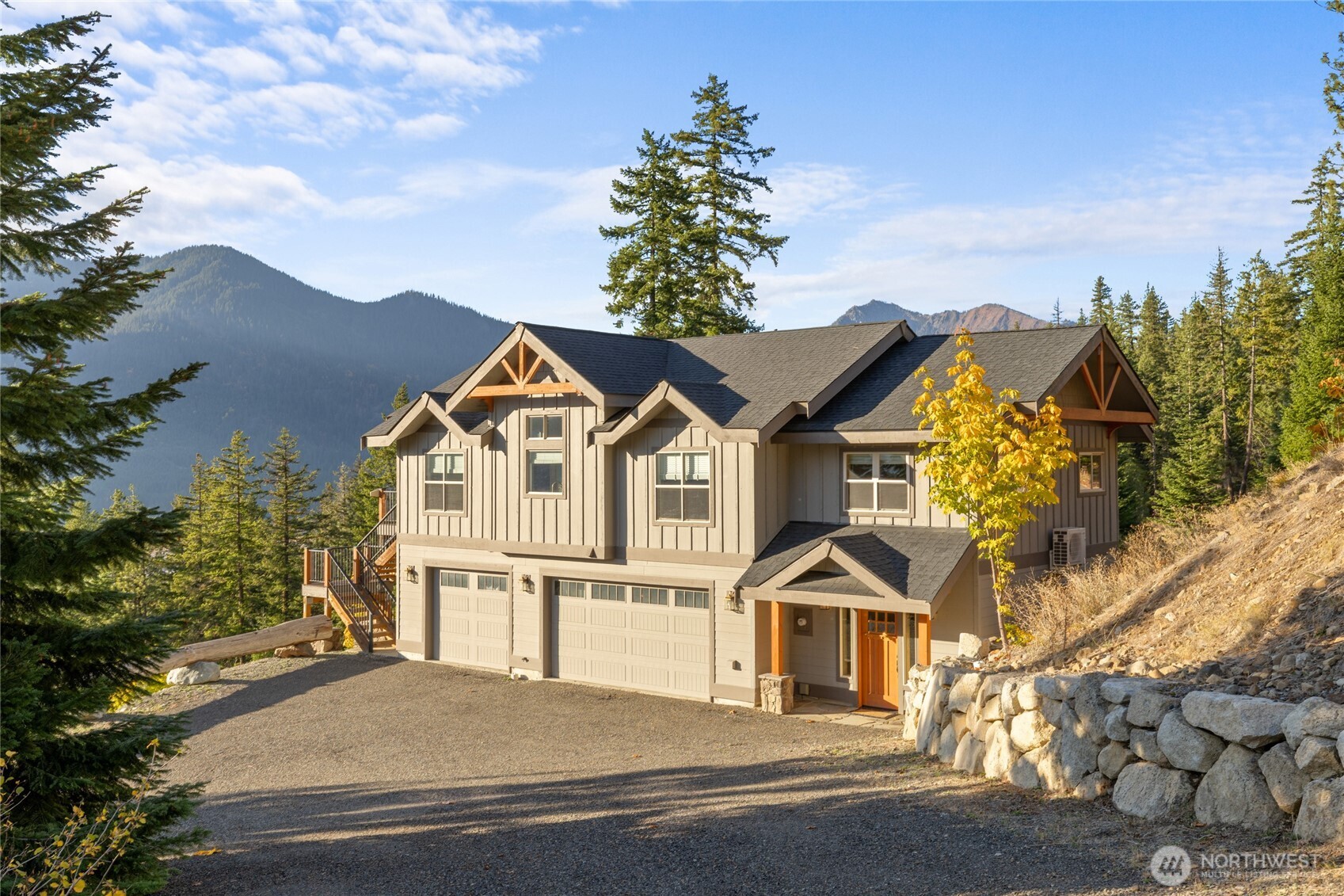 1840 Morgan Creek Road Ronald, WA 98940 - Photo 4 of 33 a front view of a house with a yard and garage