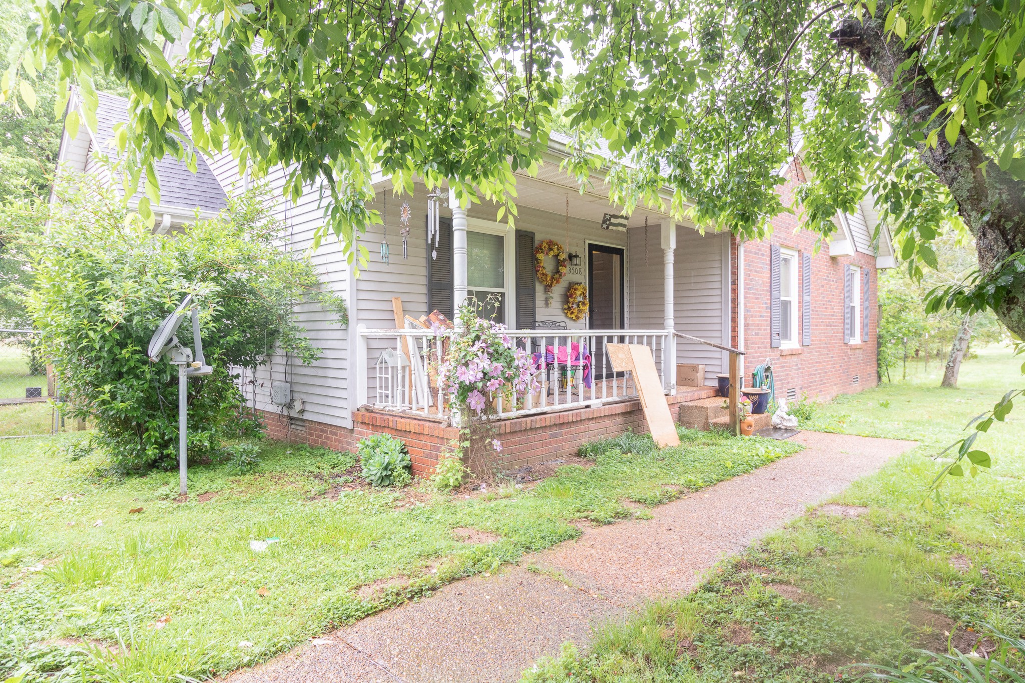 3508 Beckwith Road Mount Juliet, TN 37122 - Photo 3 of 26 a front view of a house with a yard table and chairs