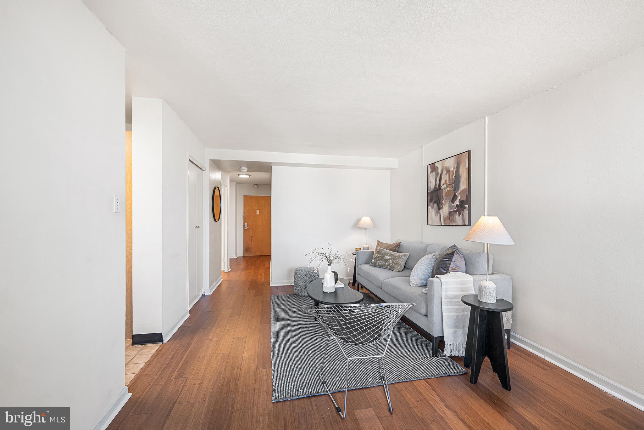 604 South Washington Square, Unit 2606 Philadelphia, PA 19106 - Photo 16 of 37 a living room with furniture and a wooden floor