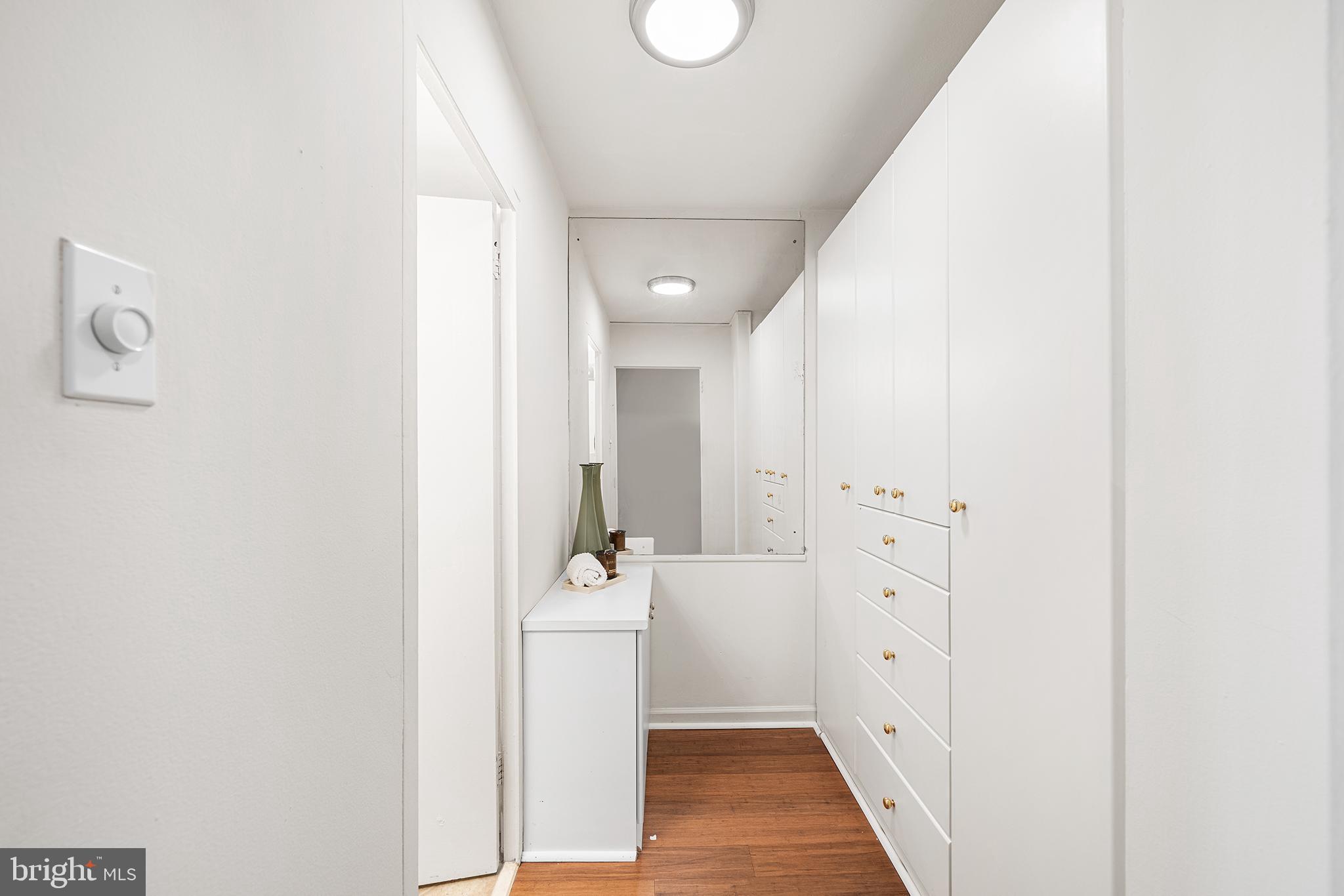 604 South Washington Square, Unit 2606 Philadelphia, PA 19106 - Photo 22 of 37 a bathroom with a sink and mirror