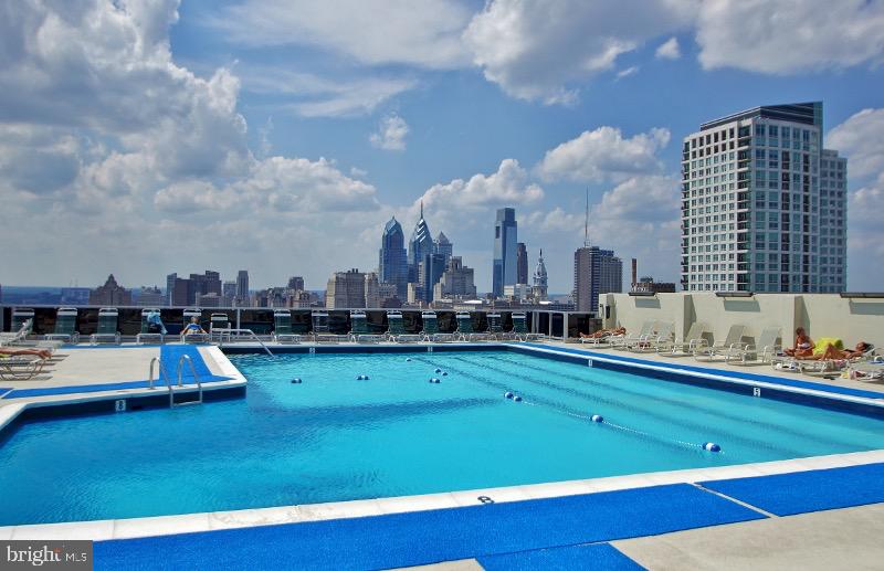 604 South Washington Square, Unit 2606 Philadelphia, PA 19106 - Photo 36 of 37 a view of a swimming pool and lounge chairs