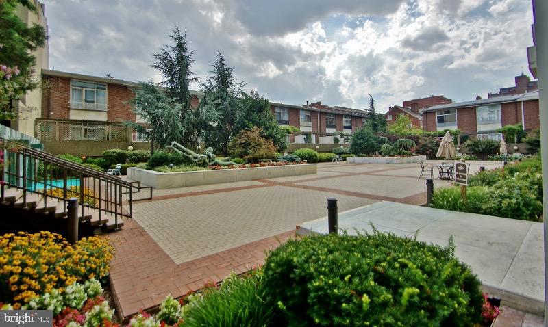 604 South Washington Square, Unit 2606 Philadelphia, PA 19106 - Photo 37 of 37 a street view with flower plants and wooden fence