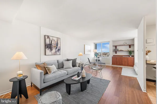 a living room with furniture and a table