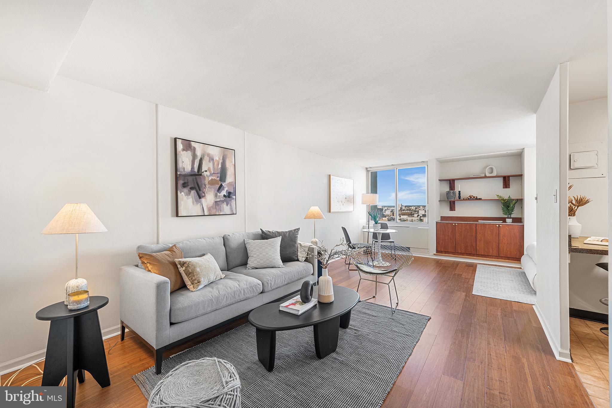 604 South Washington Square, Unit 2606 Philadelphia, PA 19106 - Photo 4 of 37 a living room with furniture and a table