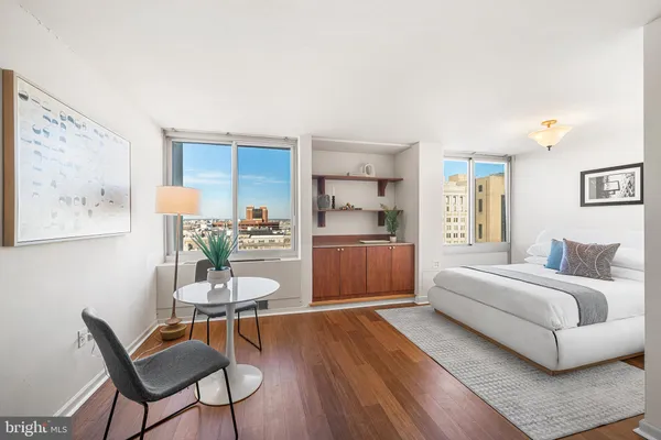 a living room with a bed and furniture