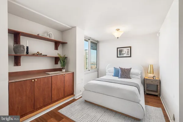 a bedroom with a bed and a cabinets