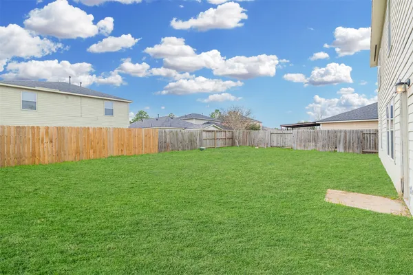 a view of a backyard with garden