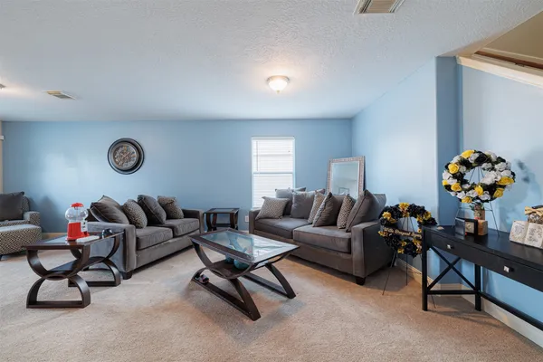 a living room with furniture and a couch