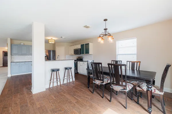 a view of a dining room with furniture