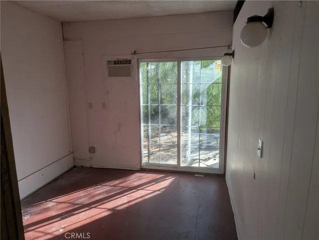 a view of a room with wooden floor and balcony