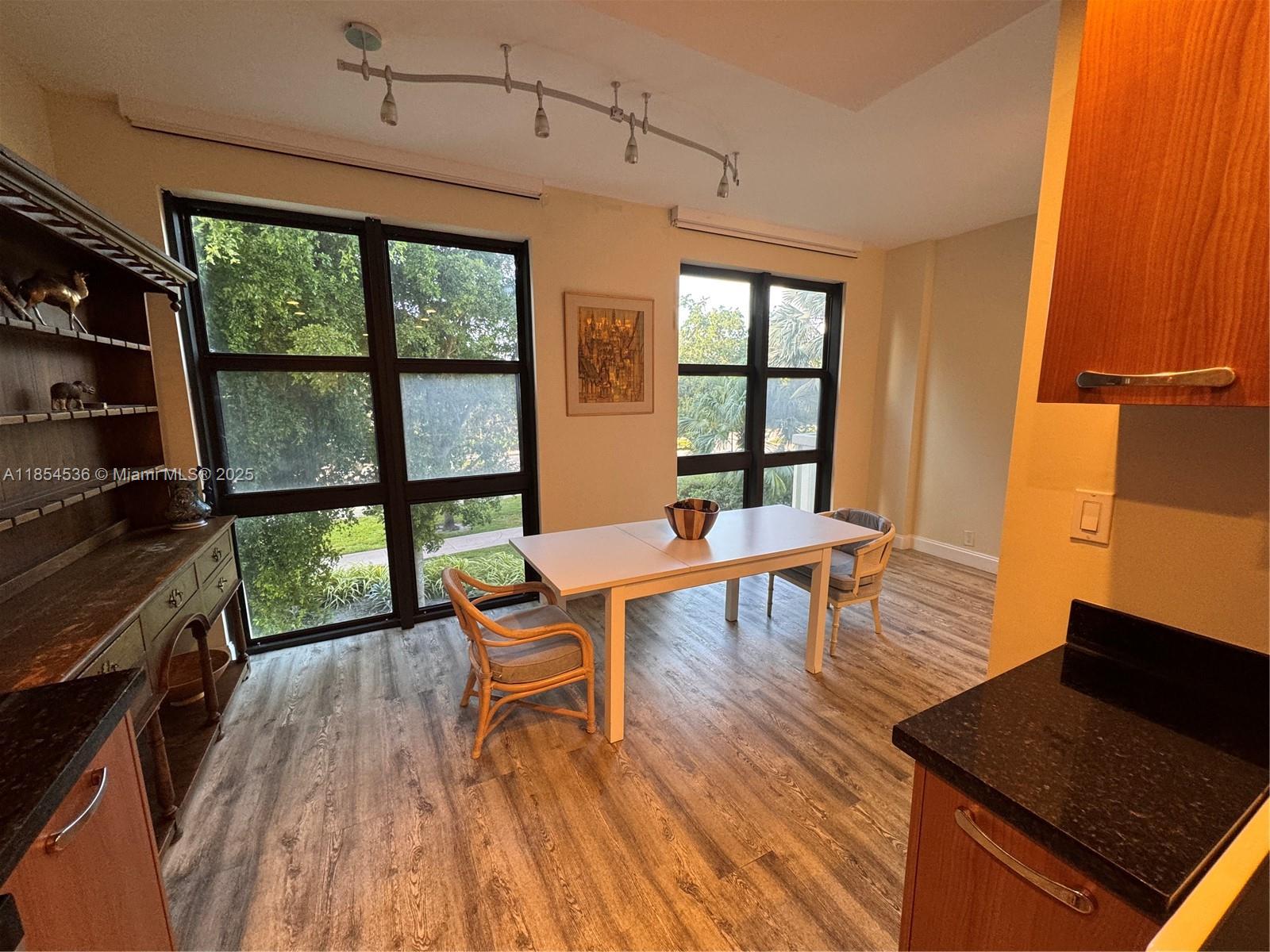 1121 Crandon Boulevard, Unit E108 Key Biscayne, FL 33149 - Photo 18 of 54 a living room with furniture and a wooden floor