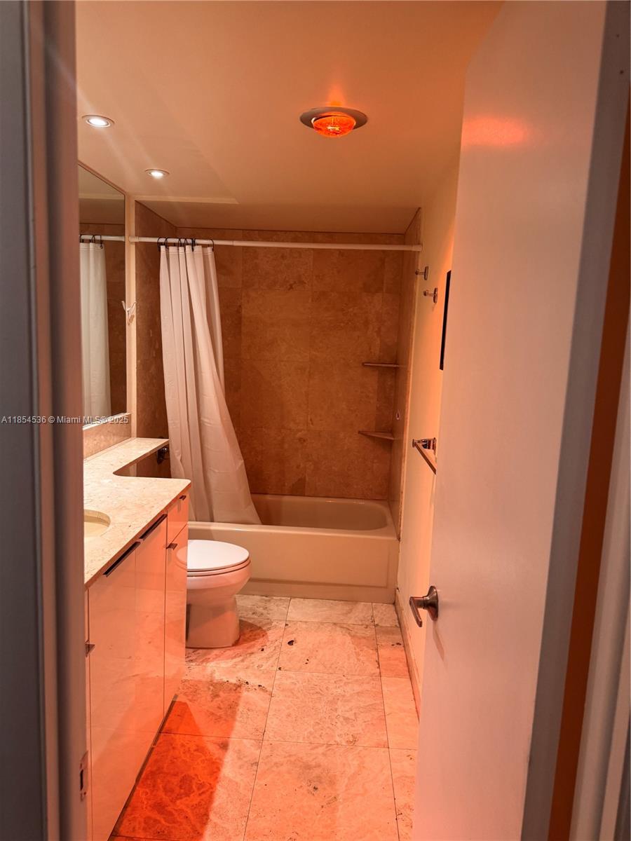 1121 Crandon Boulevard, Unit E108 Key Biscayne, FL 33149 - Photo 41 of 54 a bathroom with a toilet and a shower