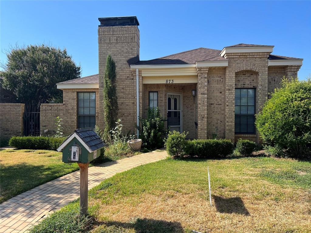 873 Cloverleaf Lane Abilene, TX 79601 - Photo 1 of 1 a front view of a house with garden