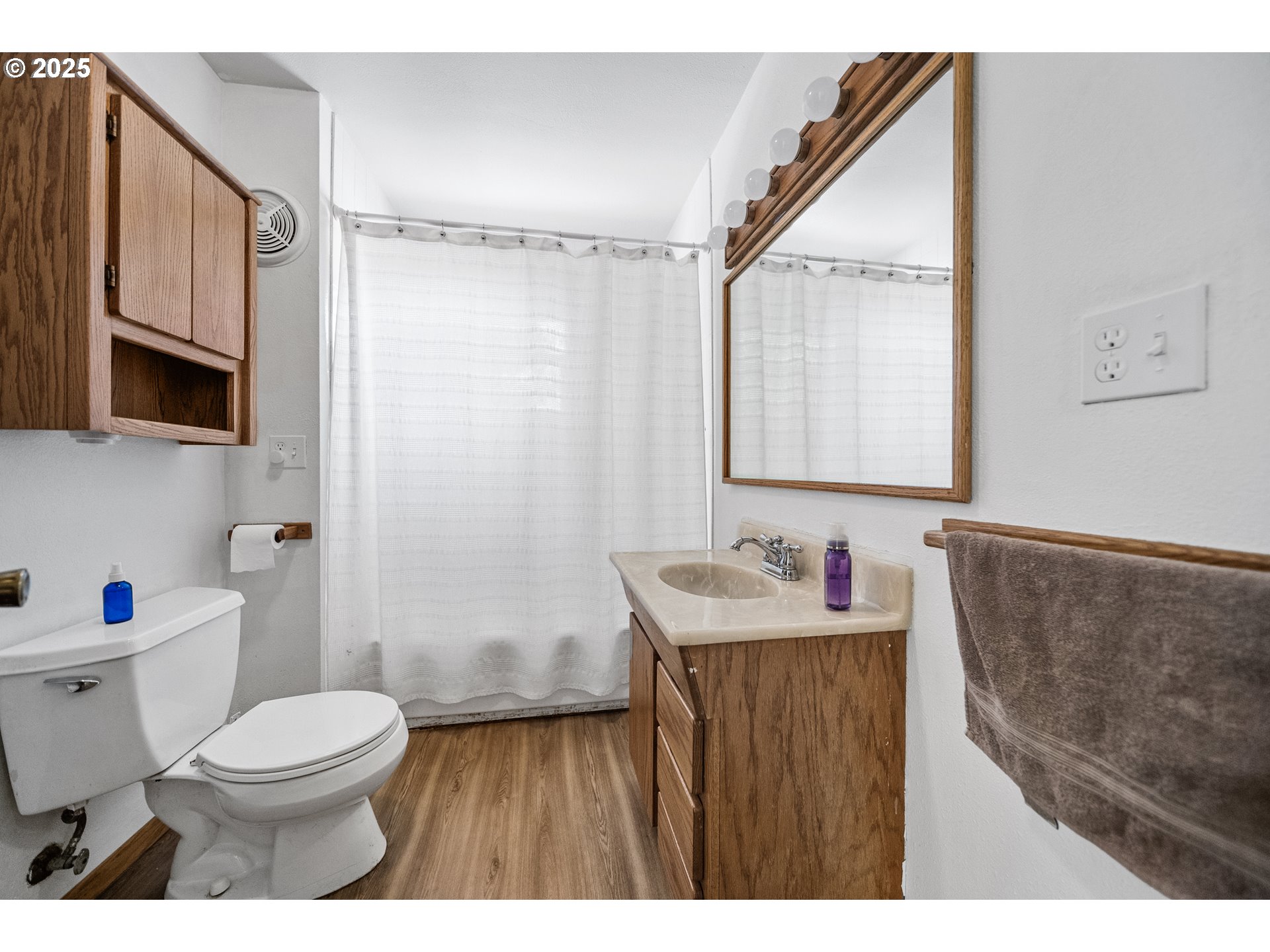 15317 South Hattan Road Oregon City, OR 97045 - Photo 22 of 44 a bathroom with a sink a toilet a mirror and shower