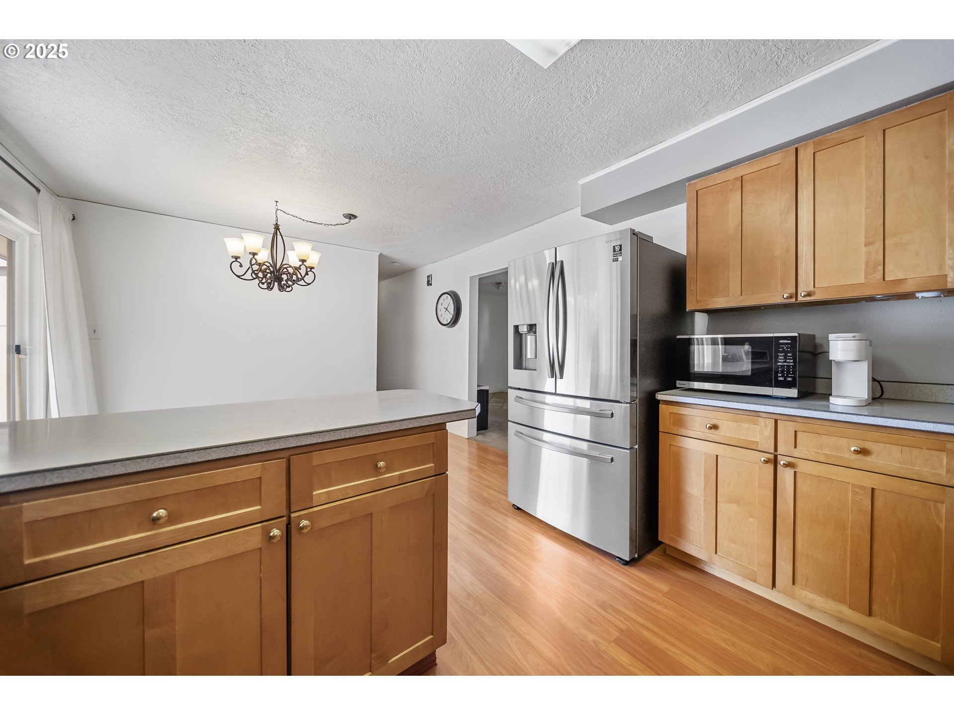 15317 South Hattan Road Oregon City, OR 97045 - Photo 8 of 44 a kitchen with stainless steel appliances a refrigerator sink and cabinets