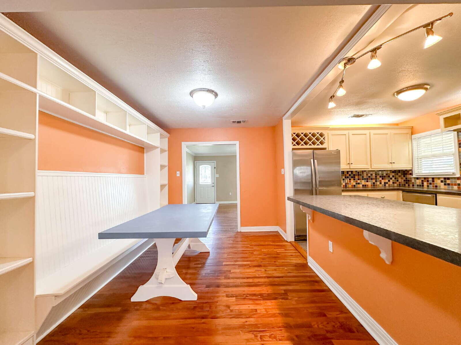 2614 32nd Street Lubbock, TX 79410 - Photo 15 of 37 a view of a living room and kitchen with a large window