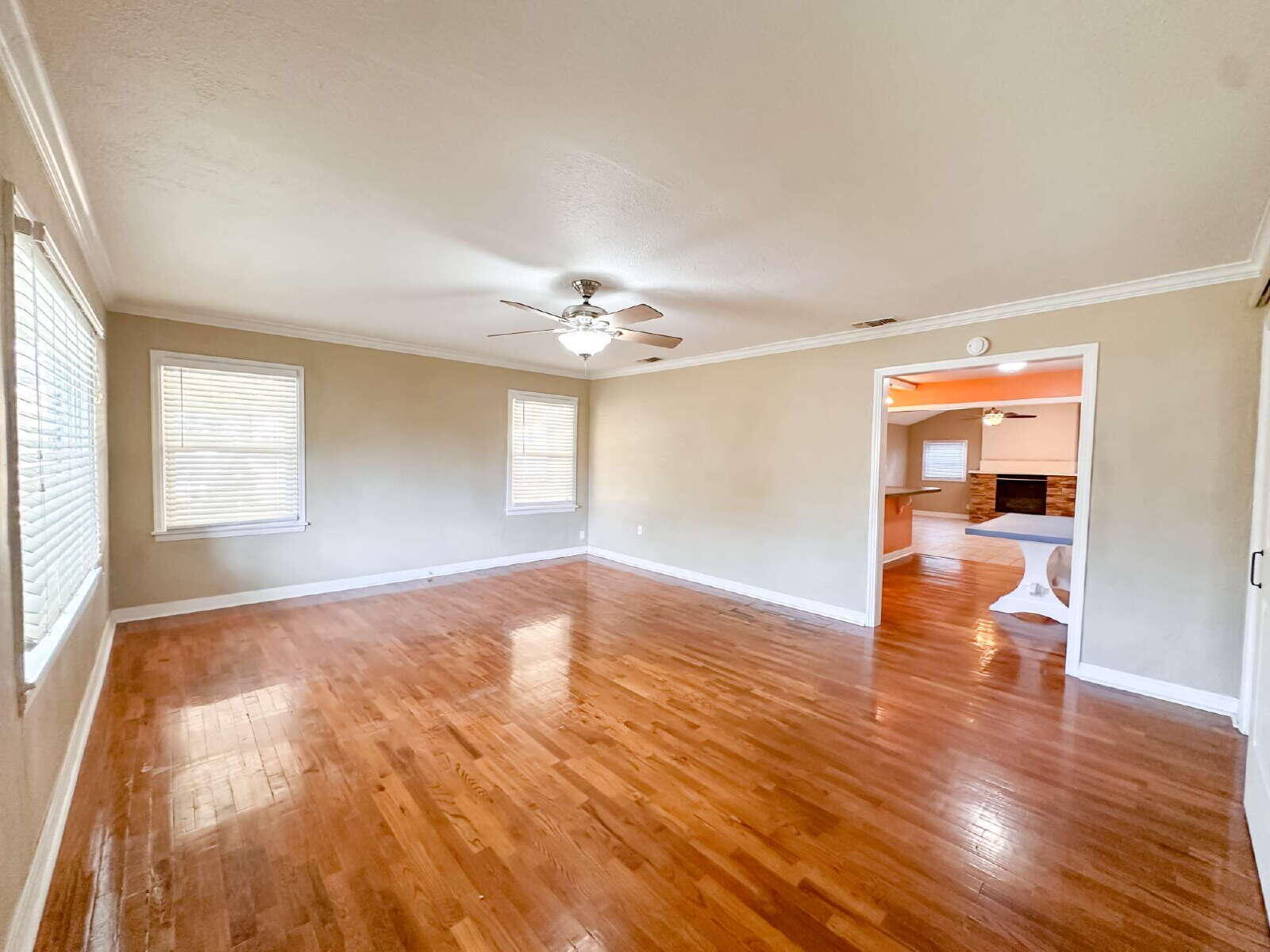 2614 32nd Street Lubbock, TX 79410 - Photo 3 of 37 a view of empty room with wooden floor and fan