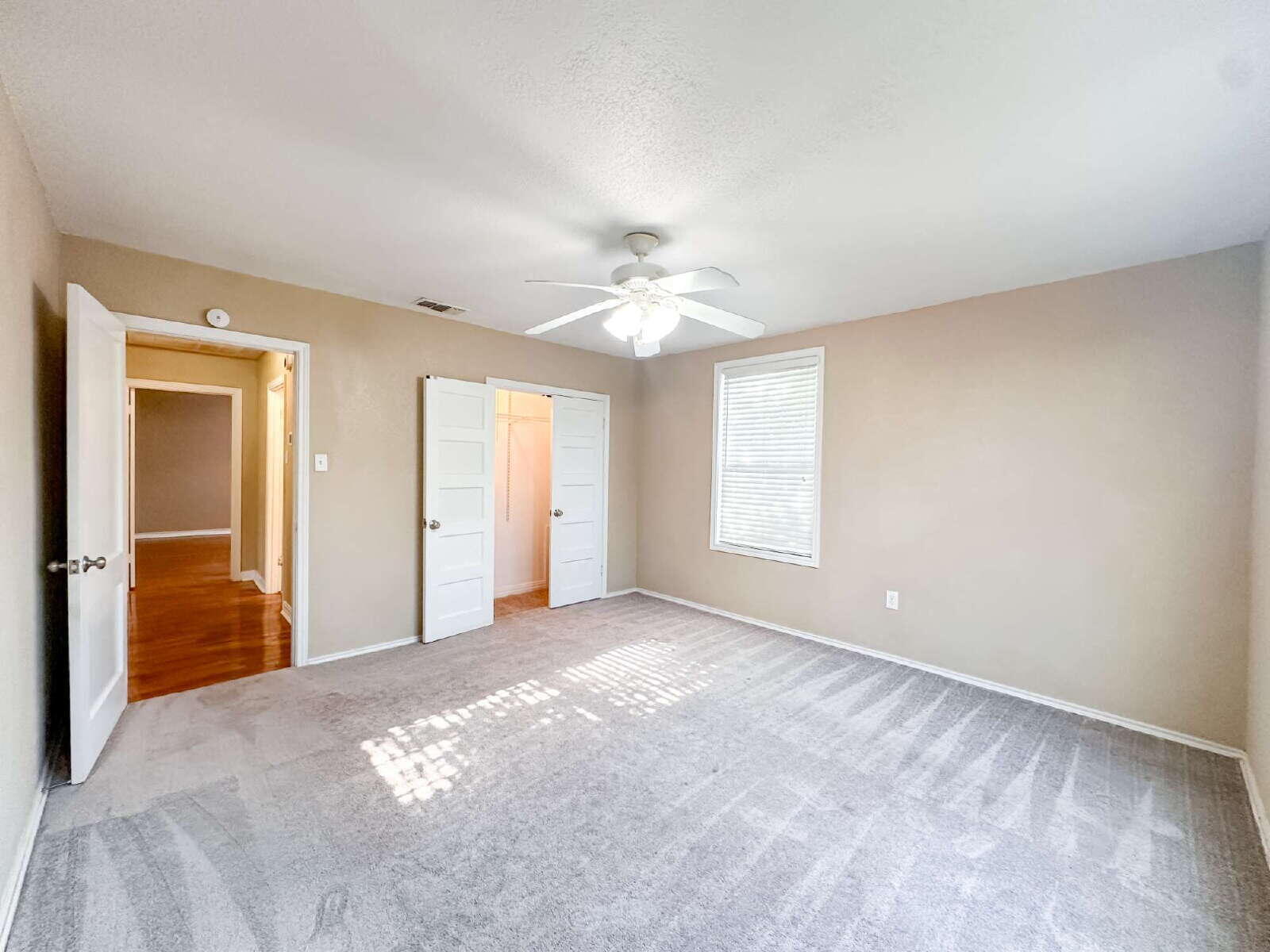 2614 32nd Street Lubbock, TX 79410 - Photo 31 of 37 a view of a livingroom with a chandelier fan and windows