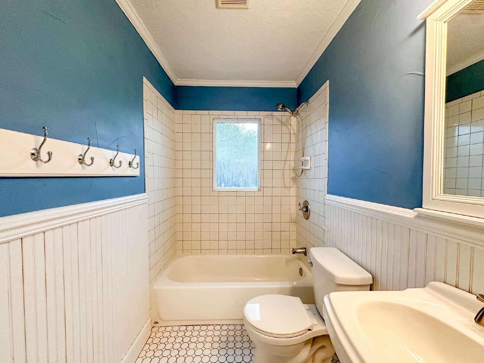 2614 32nd Street Lubbock, TX 79410 - Photo 33 of 37 a bathroom with a toilet a sink and bathtub