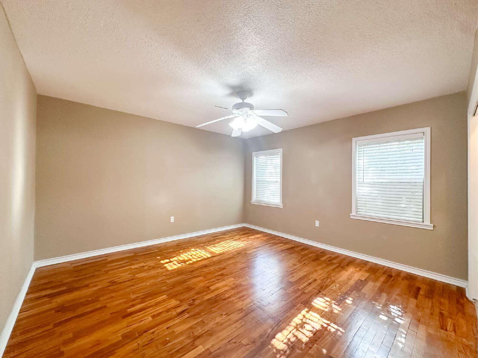 2614 32nd Street Lubbock, TX 79410 - Photo 34 of 37 a view of an empty room with wooden floor and a window