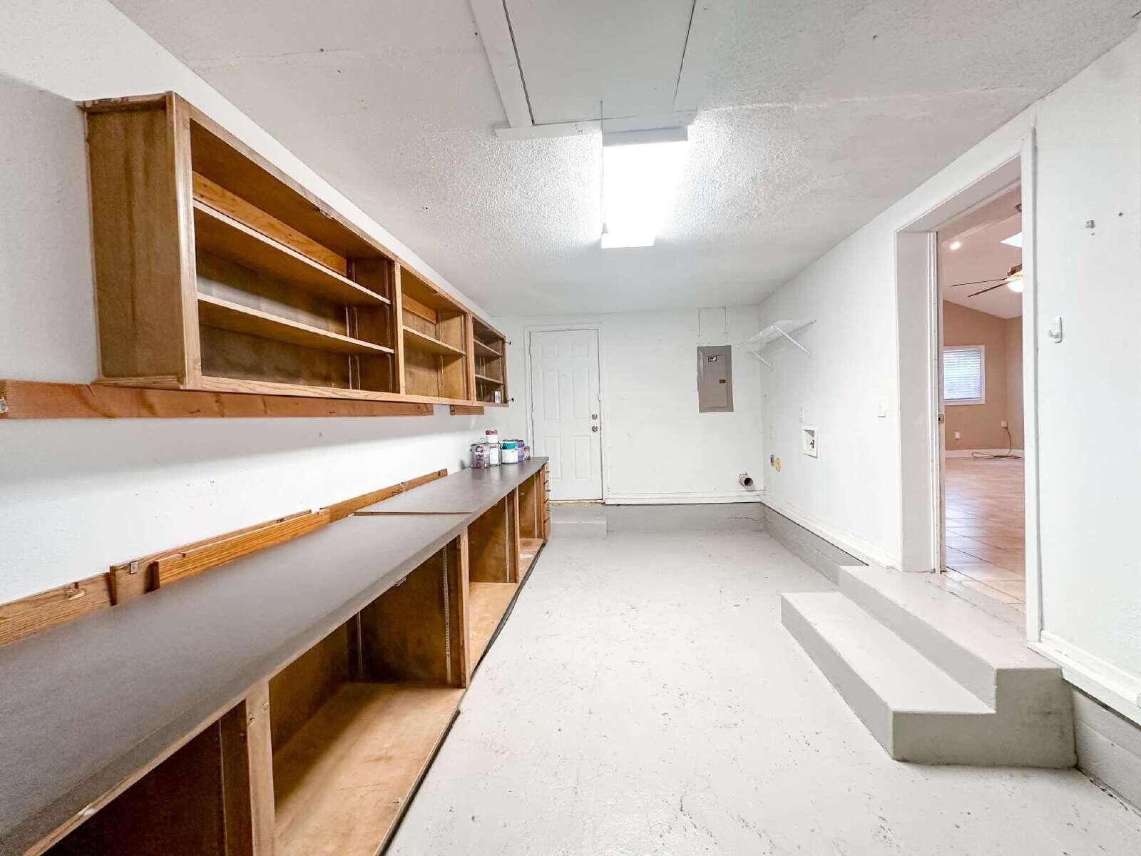 2614 32nd Street Lubbock, TX 79410 - Photo 37 of 37 a view of a large kitchen with wooden floor and stairs