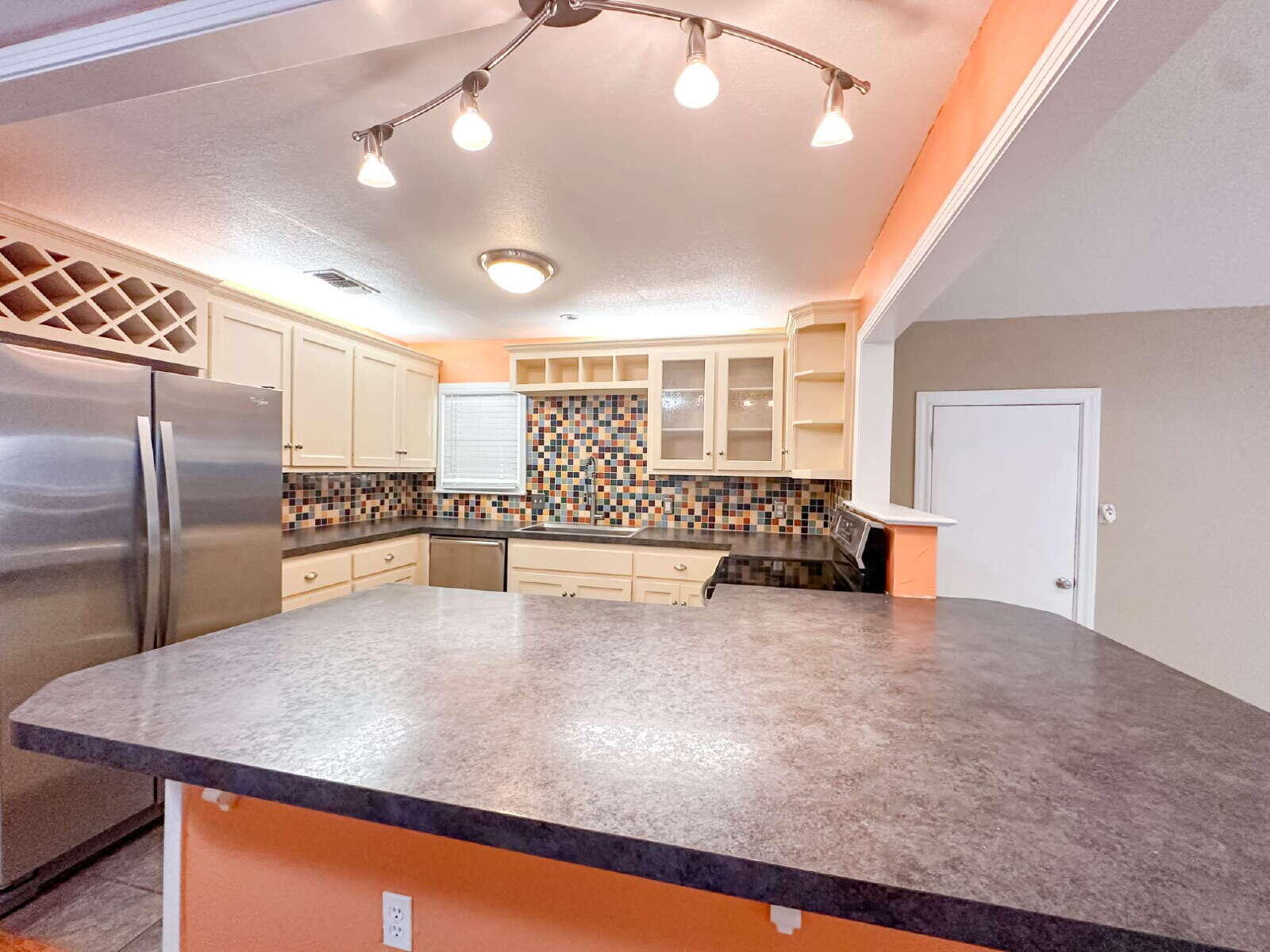 2614 32nd Street Lubbock, TX 79410 - Photo 9 of 37 a view of kitchen with furniture and refrigerator