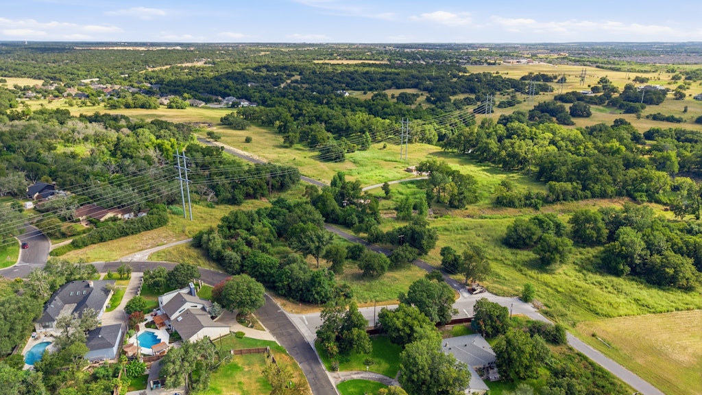 Tbd Tbd Belton, TX 76513 - Photo 4 of 16 Mature trees and open green spaces define this scenic neighborhood landscape.