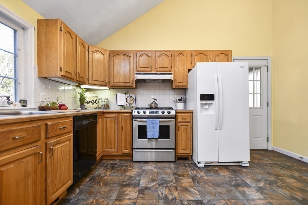 0 Cedar Street Burlington, MA 01803 - Photo 13 of 30 a kitchen with stainless steel appliances granite countertop a refrigerator and a stove