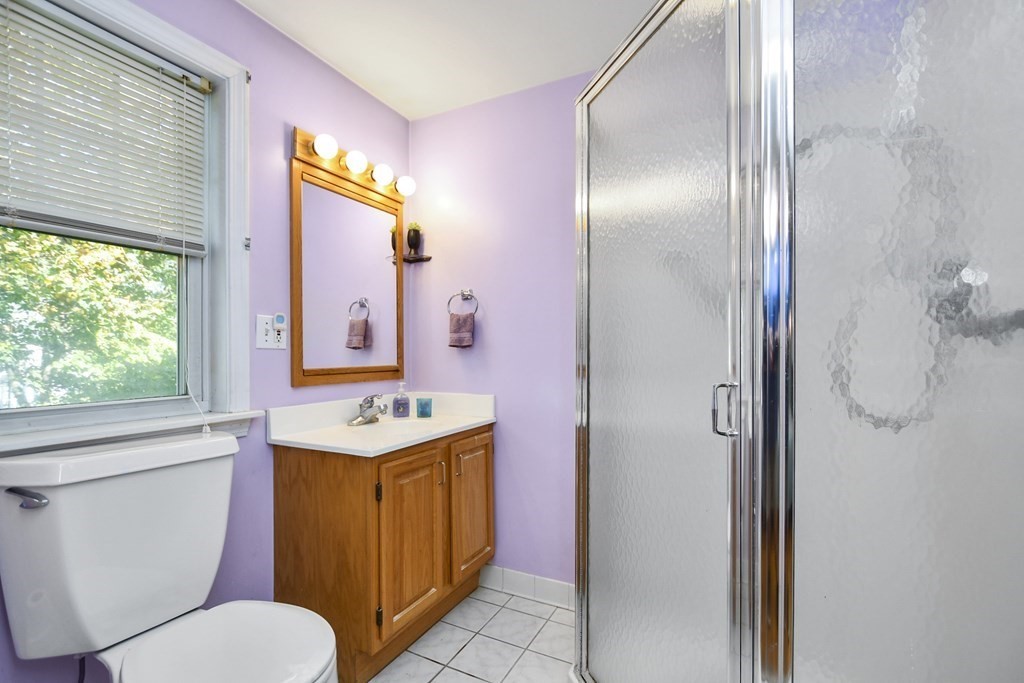 0 Cedar Street Burlington, MA 01803 - Photo 18 of 30 a bathroom with a sink toilet vanity and shower