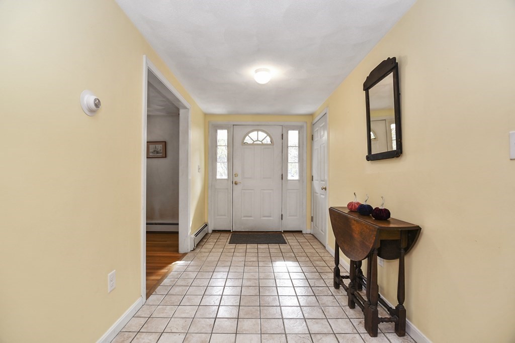 0 Cedar Street Burlington, MA 01803 - Photo 5 of 30 a view of a hallway with wooden floor and a bathroom