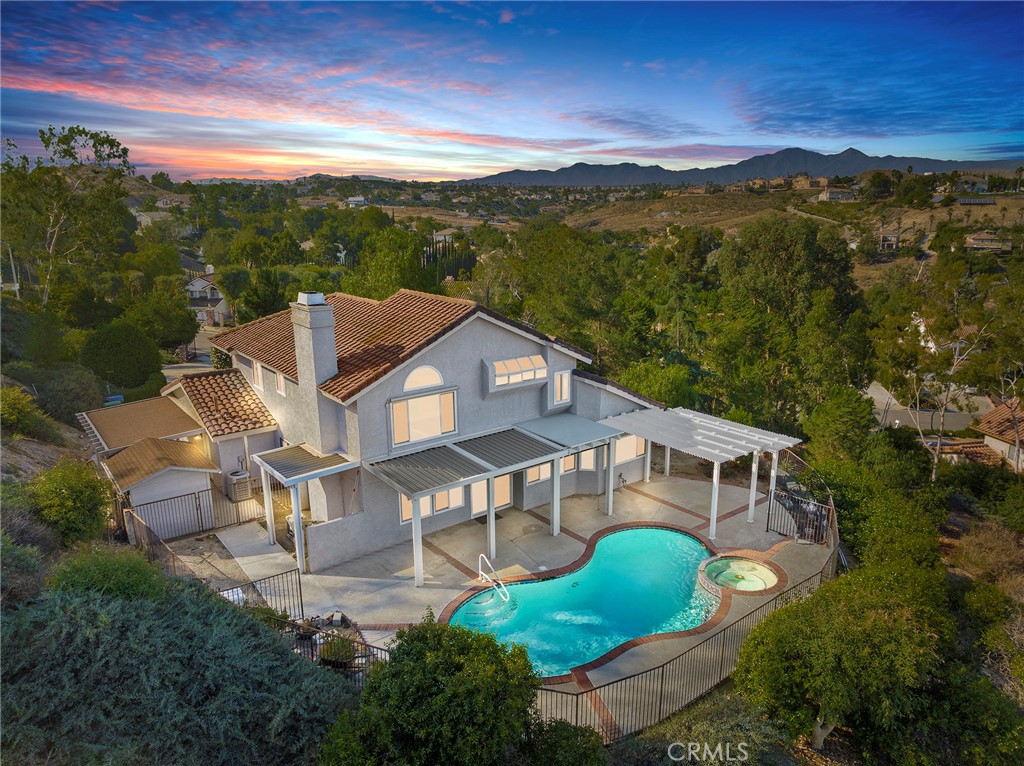 an aerial view of a house with a garden