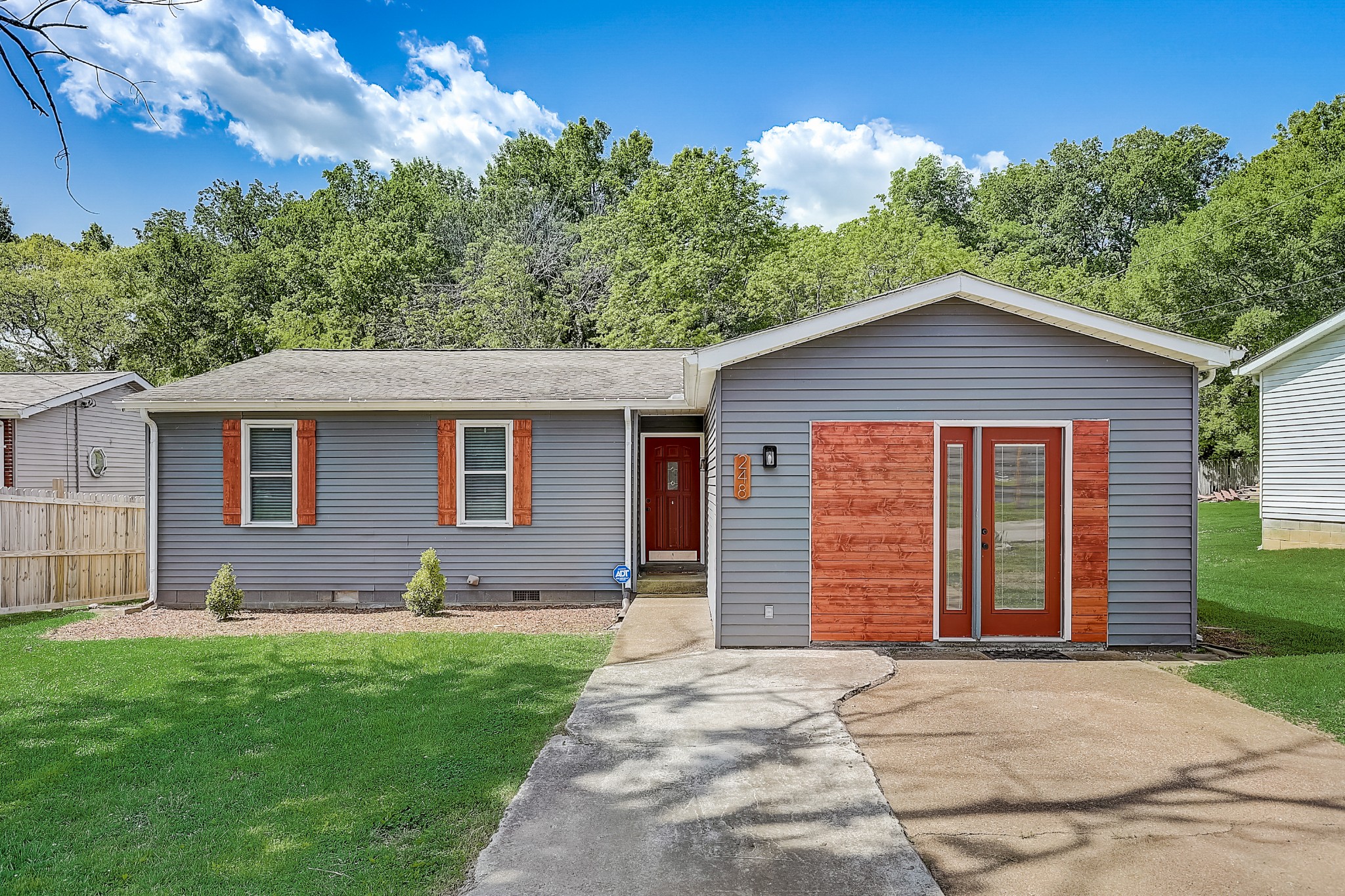 248 Manzano Road Madison, TN 37115 - Photo 1 of 27 a front view of a house with a yard and garage