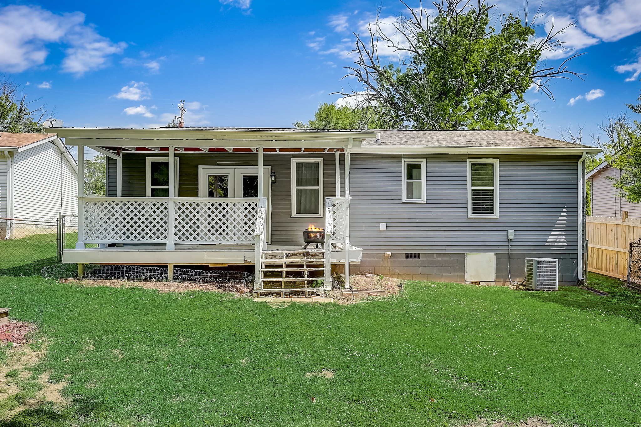248 Manzano Road Madison, TN 37115 - Photo 23 of 27 a front view of a house with a garden