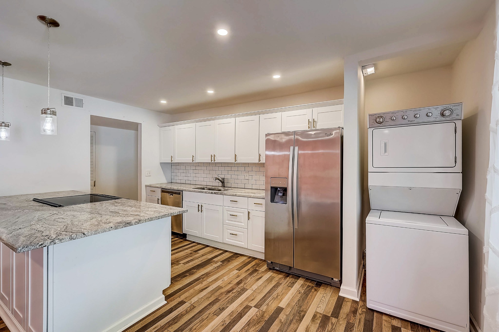 248 Manzano Road Madison, TN 37115 - Photo 8 of 27 a kitchen with a refrigerator a sink and wooden cabinets