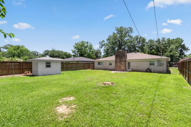 a picture of a bathroom with a shower