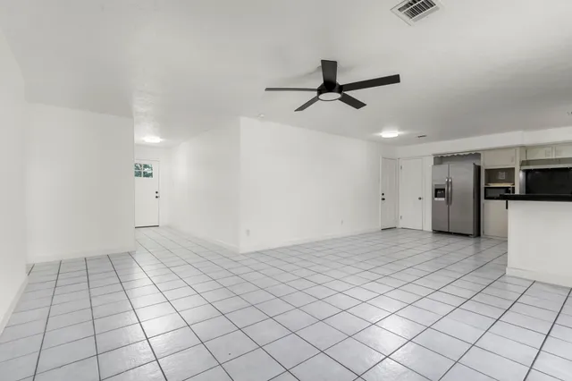 a view of an empty room with a fireplace