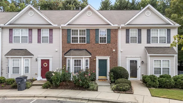 a front view of a house with yard