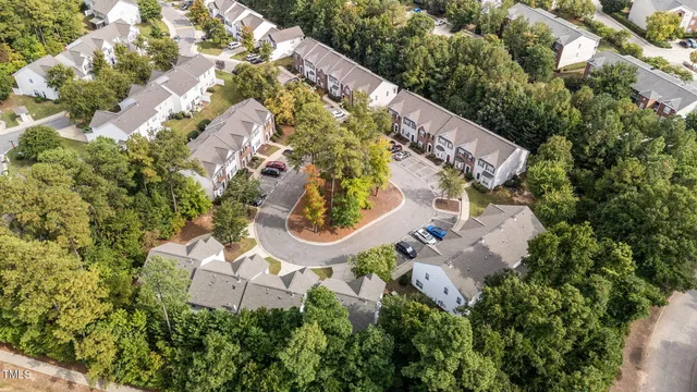 aerial view of a house with swimming pool and sitting area