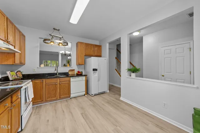 an aerial view of a house with a yard and garden