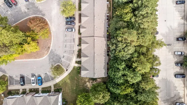 a kitchen with a refrigerator cabinets and wooden floor