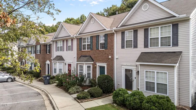 a view of multiple houses with a yard