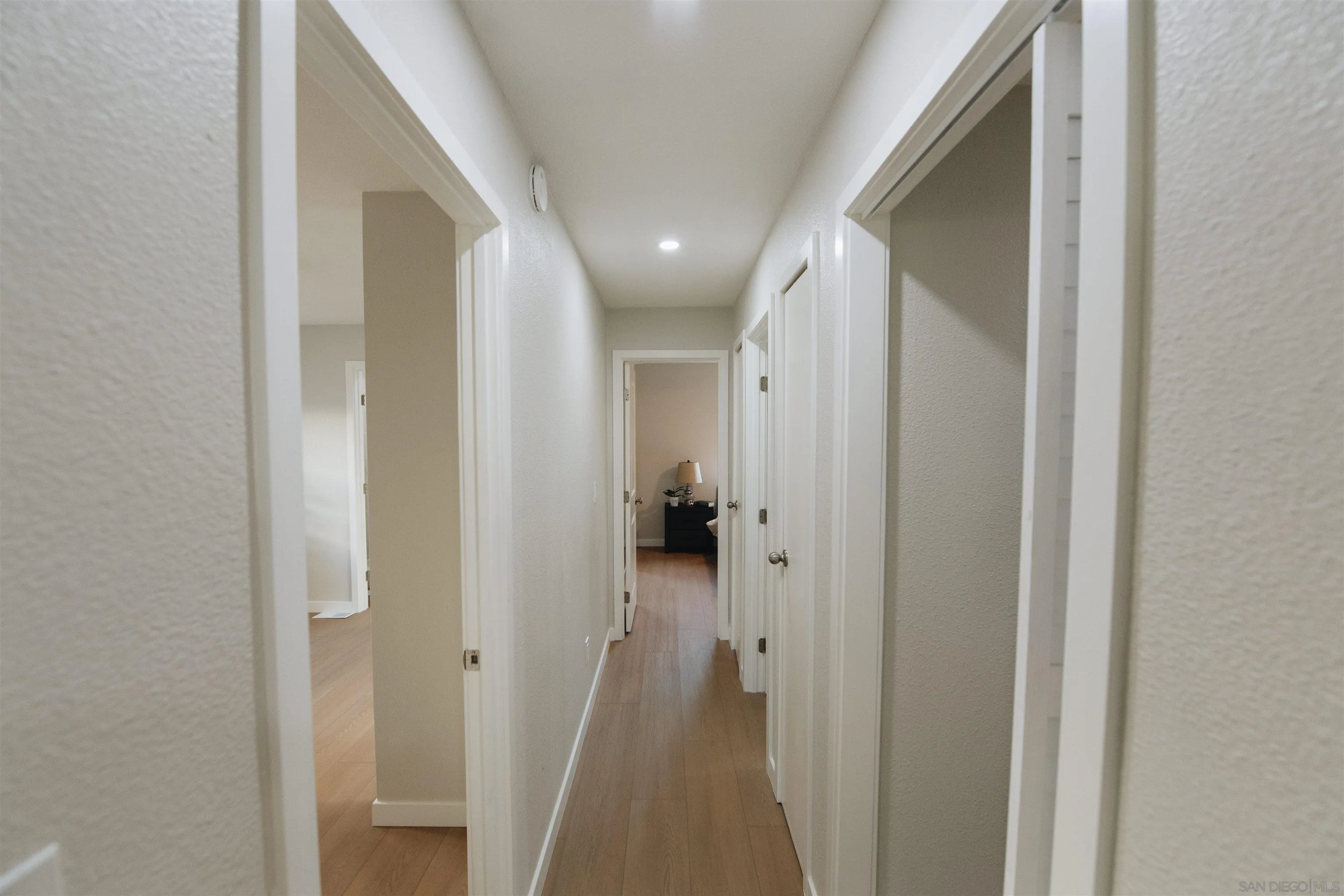 2400 Alpine Boulevard, Unit 8 Alpine, CA 91901 - Photo 11 of 26 a view of a hallway with a livingroom and a bathroom with sink